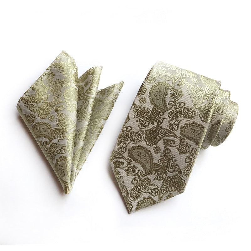A necktie adorned with a sophisticated ivory paisley pattern, highlighting their stylish and unique design.