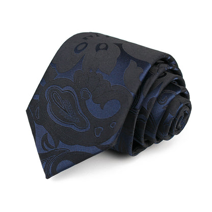 A sophisticated black tie adorned with a blue and black paisley pattern, ideal for enhancing formal wear.