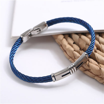  A blue cable bracelet featuring a sleek stainless steel clasp, showcasing a modern and stylish design.