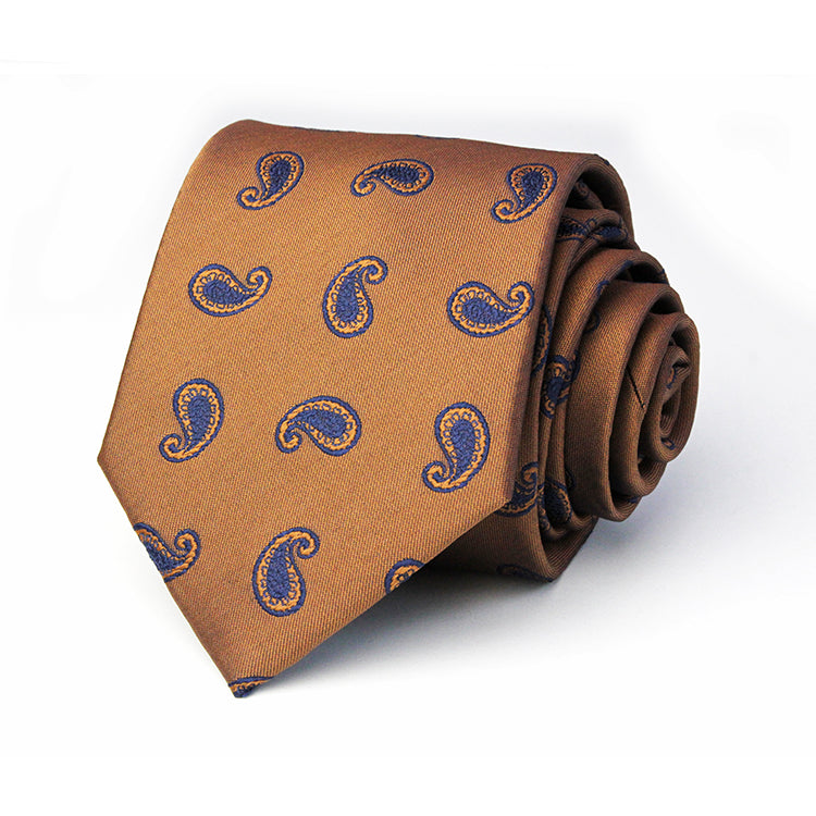 A brown tie with a blue paisley pattern