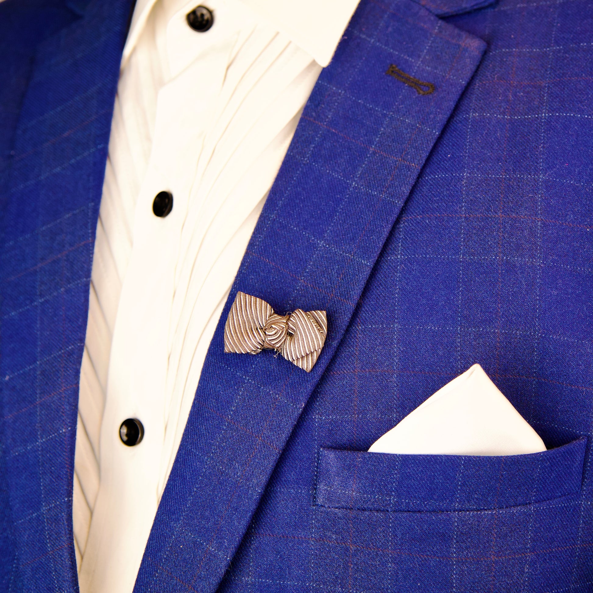 "Masculine Dusky Bow brooch in silver, perfect for lapels or suits"