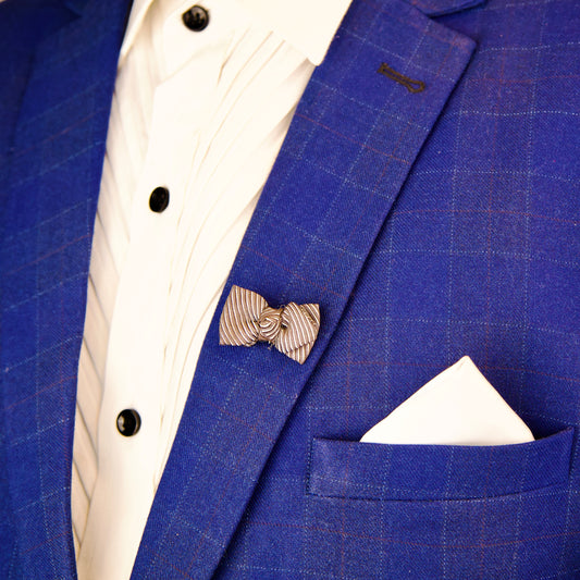 "Masculine Dusky Bow brooch in silver, perfect for lapels or suits"