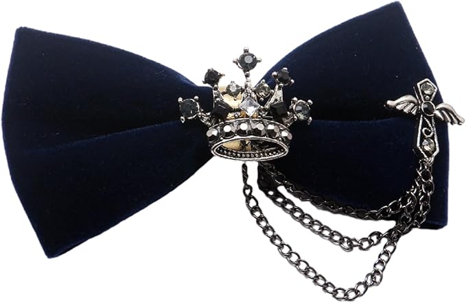 A black velvet bow tie adorned with a silver chain and a decorative flower, showcasing elegance and sophistication.