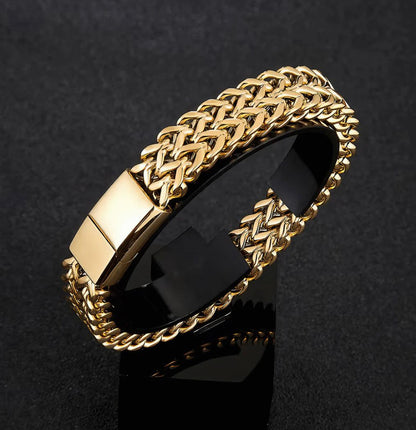 Gold chain bracelet on a black background