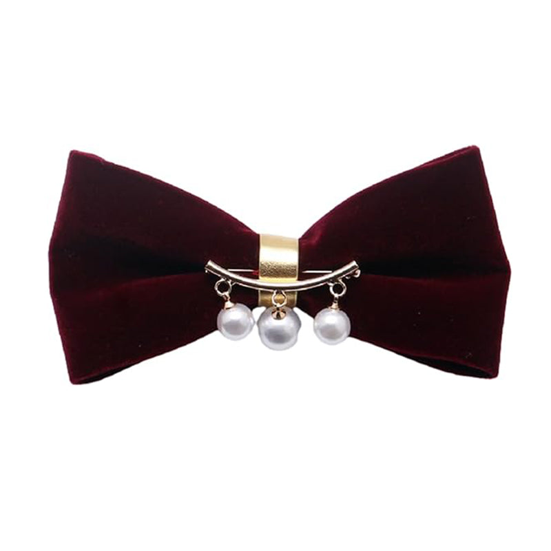 A red velvet bow tie adorned with elegant pearls, showcasing a sophisticated and stylish accessory for formal attire.