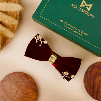 A stylish bow tie placed next to an elegant box of mr dapper's perfect for a special occasion.