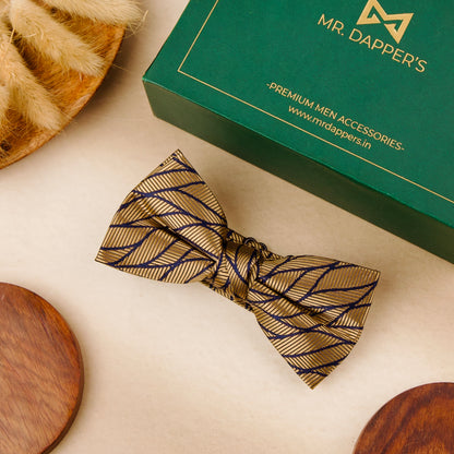 A stylish bow tie and a small wooden bowl are placed on a table, highlighting a unique combination of sophistication and simplicity.