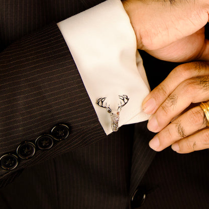 pair of elegant silver cufflinks featuring intricately designed deer head motifs, showcasing refined craftsmanship.