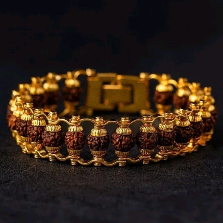 Gold and brown beaded bracelet on a dark background