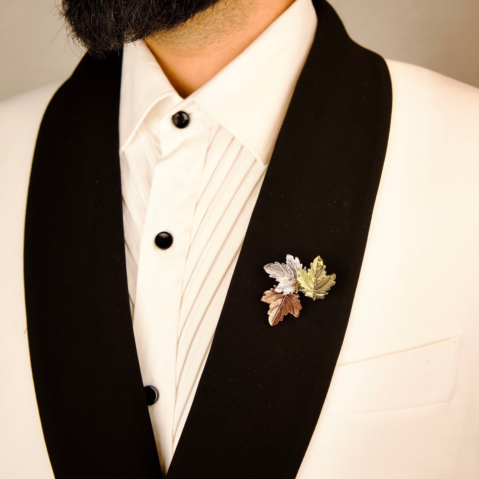 "Nature-themed Trio Leaflet Brooch, refined accessory for formalwear"